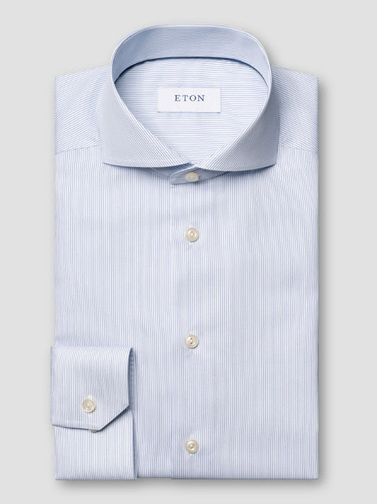 The Eton Slim Fit Striped Twill Dress Shirt in dark blue features an extreme cut away collar and is displayed against a plain gray background.