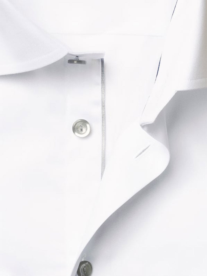 Close-up of the Eton Slim Fit Signature Twill Dress Shirt in white with grey details, showcasing the buttons, buttonholes, and part of the collar.