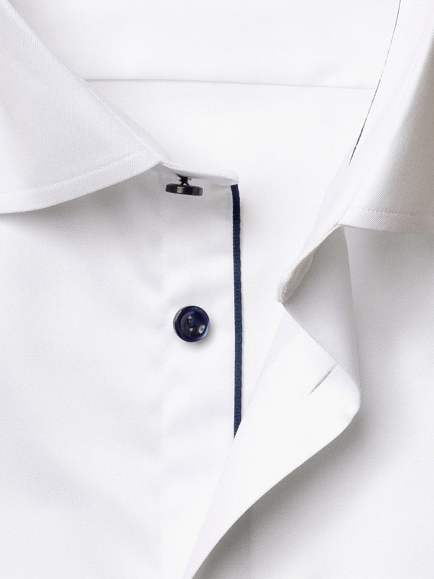 Close-up of the Eton Slim Fit Solid Signature Twill Dress Shirt in white, showcasing navy details along the button placket and contrasting navy buttons.