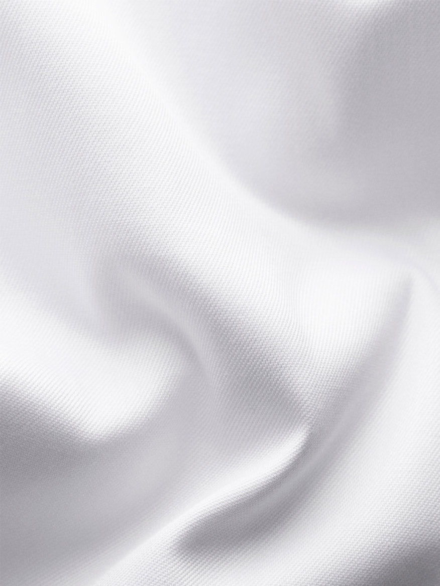 Close-up of the Eton Contemporary Fit White Twill Dress Shirt With Grey Details, showcasing the white twill fabric's visible texture and soft folds—ideal for a modern dress shirt style.
