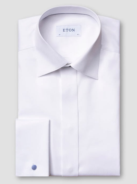 The Eton Slim Fit White Twill Evening Shirt features a spread collar and French cuffs, neatly folded against a light gray background—an ideal choice to elevate any black-tie outfit.