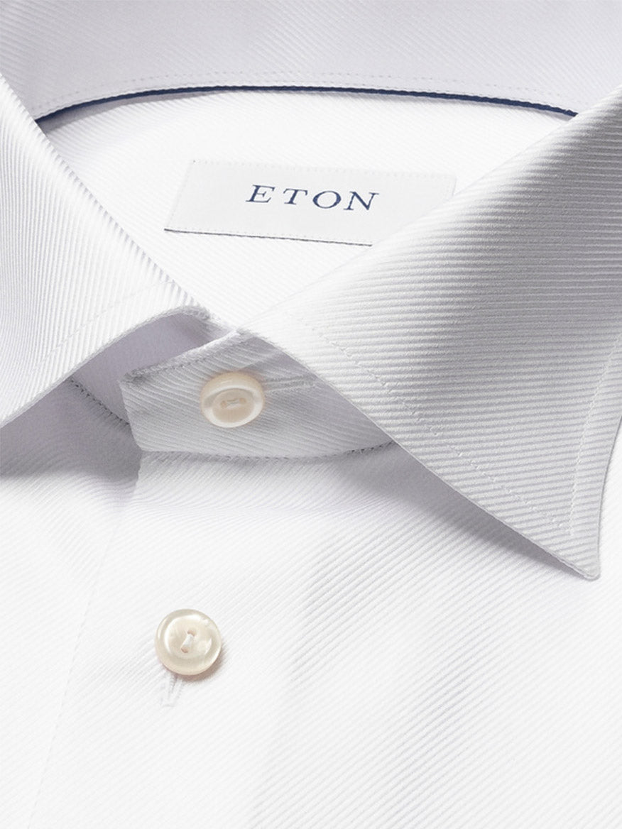 Close-up of the Eton Slim Fit Solid Textured Twill Dress Shirt in White with French cuffs, a pointed collar, buttons, and a visible "ETON" label inside the collar.