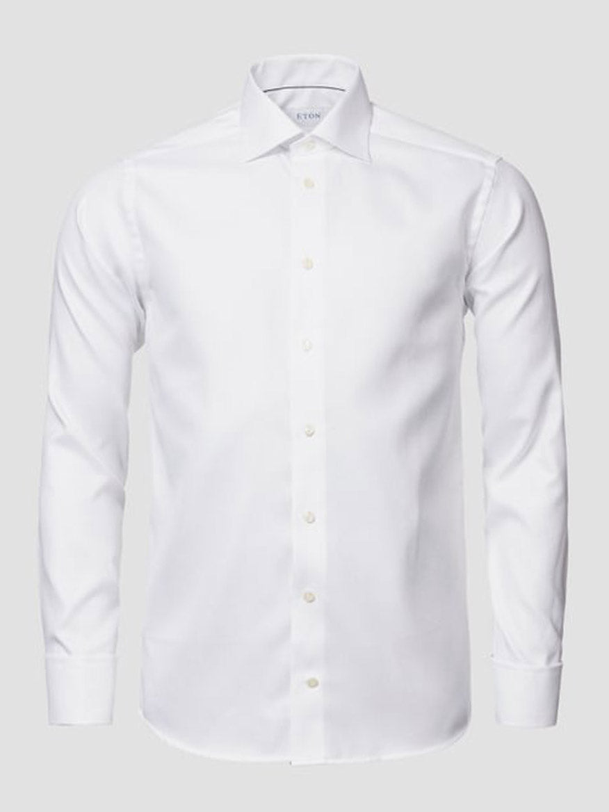 The Eton Slim Fit Solid Textured Twill Dress Shirt in White features French cuffs and a classic collar, shown against a light gray background.