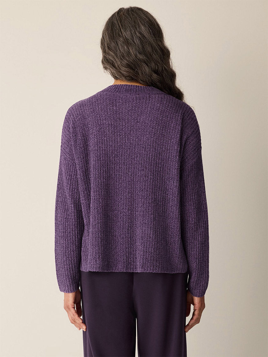 A woman wearing the Eileen Fisher Chenille Blend V-Neck Top in Mulled Grape, featuring a boxy fit.