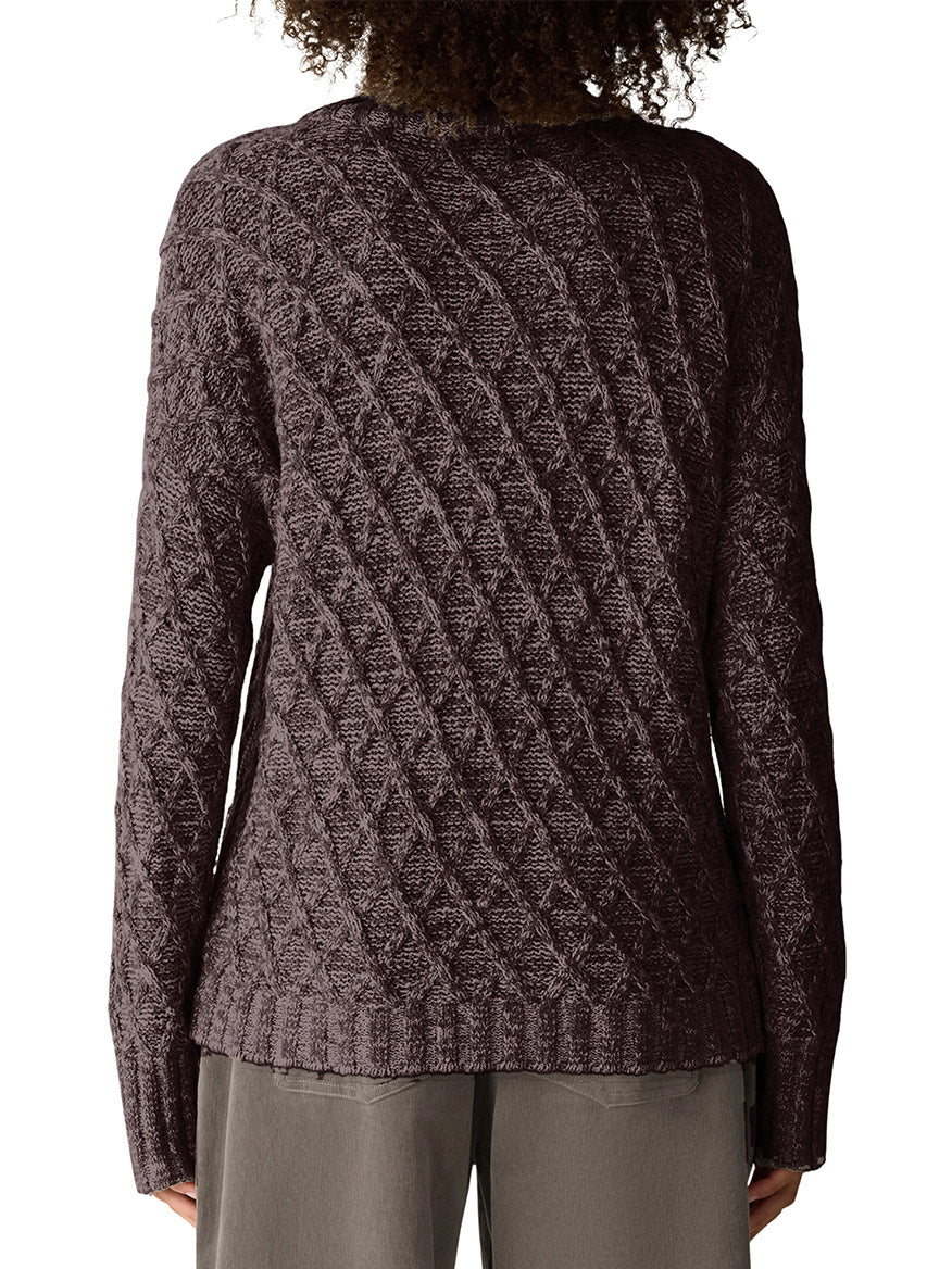 Back view of an Eileen Fisher Peruvian Cotton Boucle Fluff Turtleneck in Coffee, featuring a long-sleeved, brown organic cotton design with a textured, diagonal diamond knit pattern.