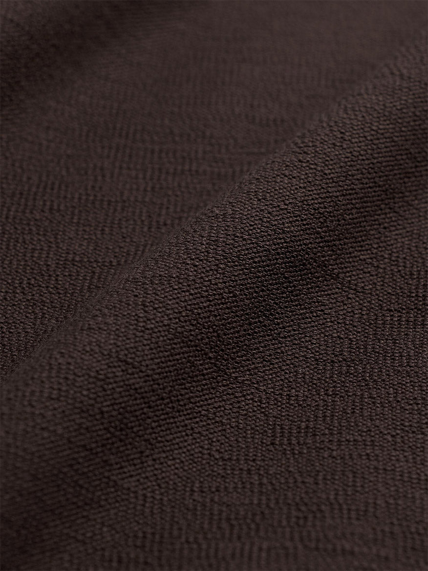 Close-up of the dark brown Eileen Fisher Washable Stretch Crepe Slim Pant in Coffee, featuring a fine, textured weave.