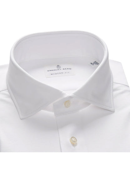 Emanuel Berg Modern 4Flex Stretch Knit Dress Shirt in White, designed with a modern fit, made from wrinkle-resistant, 4-way stretch fabric, and highlighted by a spread collar and buttoned cuffs.