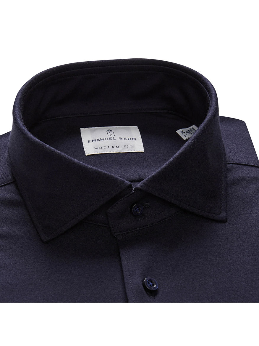 A close-up of the Emanuel Berg Modern 4Flex Stretch Knit Dress Shirt in Navy, featuring a collar and buttons. The label inside reads "Emanuel Berg, Modern Fit.