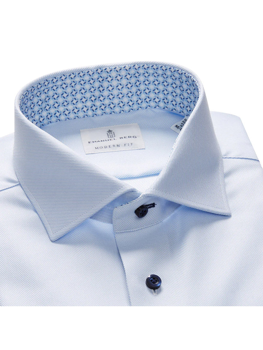 Close-up of an Emanuel Berg Modern Fit dress shirt in powder blue textured twill, showcasing a patterned inner collar and navy buttons. Ideal for those seeking a dress casual look.