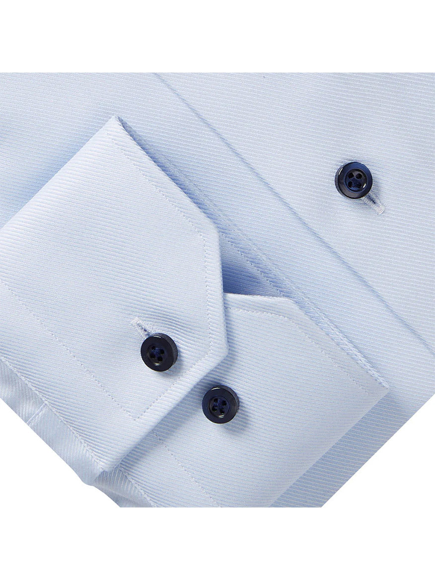 Close-up of the Emanuel Berg Modern Fit Dress Shirt in Powder Blue Textured Twill's cuff, highlighting the distinctive navy buttons, showcasing the brand's refined craftsmanship.