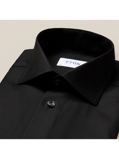 The Eton Contemporary Fit Black Textured Twill Dress Shirt is a classic dress shirt with a structured texture, featuring a collar and cuffs.