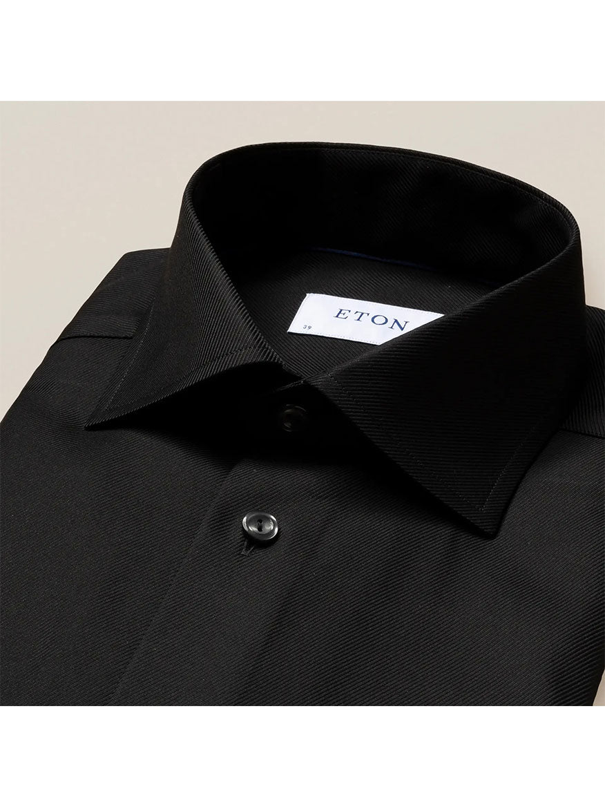 The Eton Slim Fit Black Textured Twill Dress Shirt features a buttoned collar and is the epitome of refined business attire, offering a structured texture for a sophisticated look.