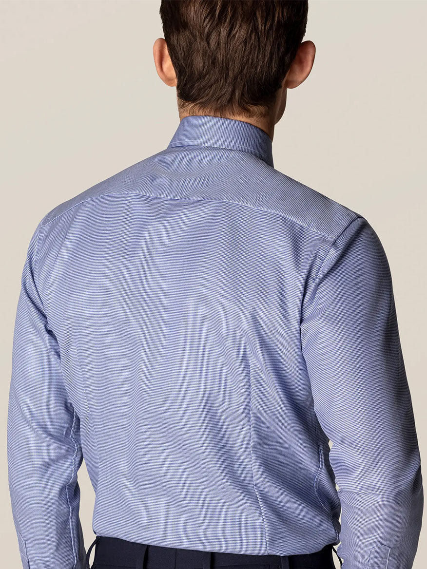 The back view of a man wearing an Eton Contemporary Fit Mid Blue Patterned Twill Dress Shirt with textured structure.