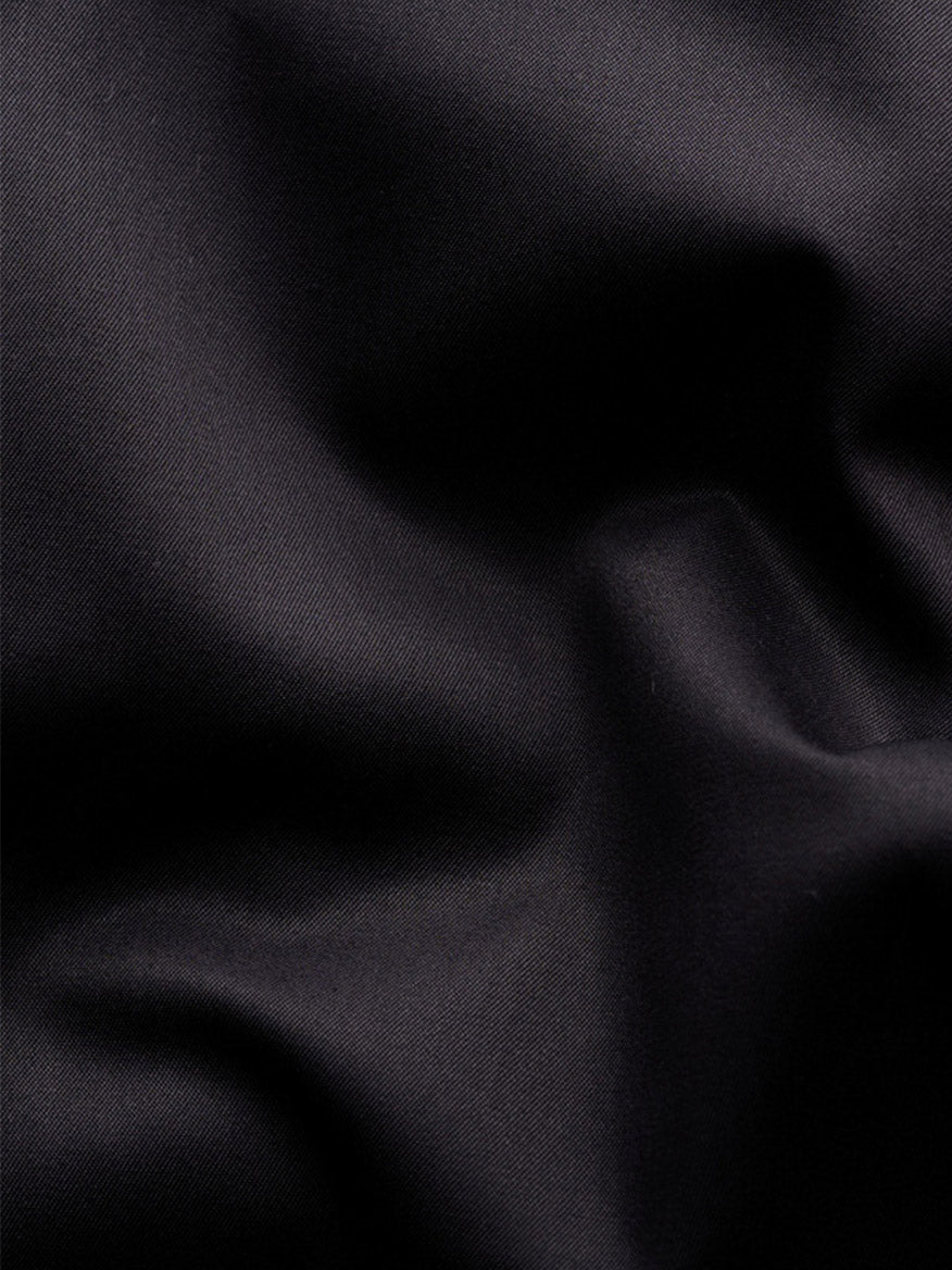 Close-up of the black Eton Contemporary Fit Solid Elevated Twill Dress Shirt, showing the organic Supima cotton’s diagonal weave texture and soft, crease-resistant folds.