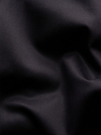 Close-up of the black Eton Contemporary Fit Solid Elevated Twill Dress Shirt, showing the organic Supima cotton’s diagonal weave texture and soft, crease-resistant folds.