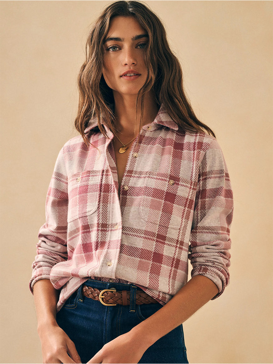 A woman wearing the Faherty Brand Legend Sweater Shirt in Amelia Plaid and jeans.