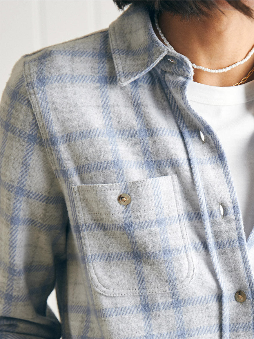 A woman wearing a Faherty Brand Legend Sweater Shirt in Spring Dew Plaid.