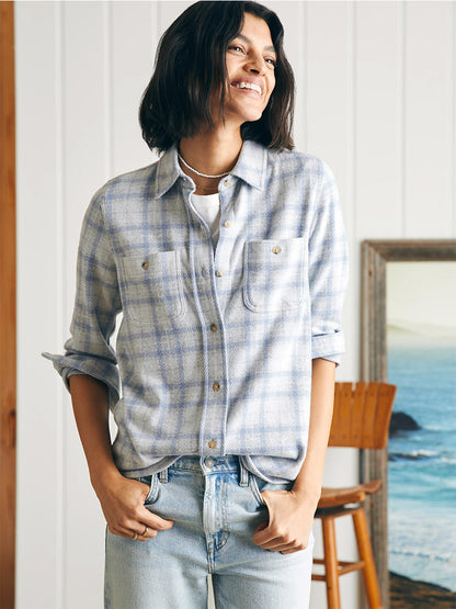 A woman wearing a Faherty Brand Legend Sweater Shirt in Spring Dew Plaid.