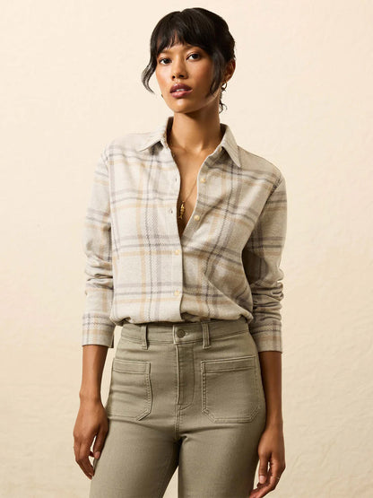 Woman wearing the Faherty Brand Legend™ Classic Sweater Shirt in Sandy Trails Plaid, a soft knit plaid shirt, styled with high-waisted khaki pants and standing against a neutral background.