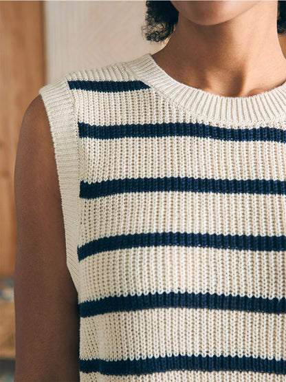Close-up of a person wearing a Faherty Brand Miramar Linen Muscle Tank in Montauk Stripe, focused on the shoulder and neckline area.