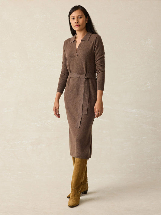 A person wearing the Faherty Brand Jackson Sweater Dress in Mocha Heather and knee-high brown boots stands against a neutral background.