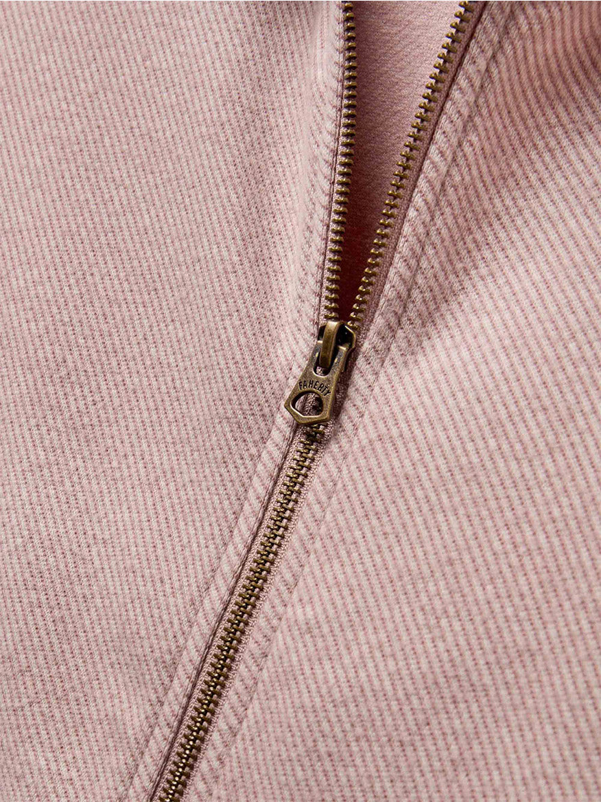 Close-up of a partially open zipper on the blush twill striped fabric, highlighting the signature softness of Faherty Brand's Legend Lounge Full Zip.