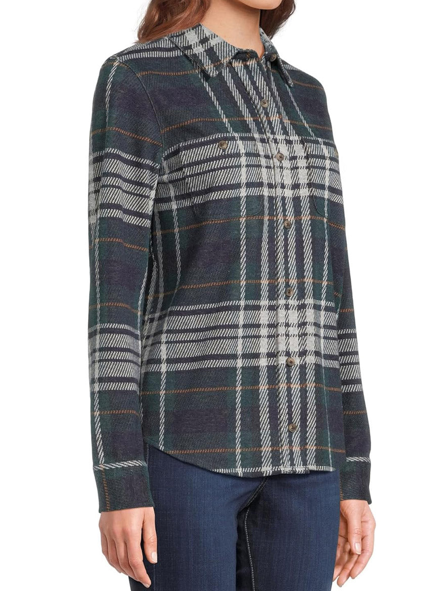 Person wearing a Faherty Brand Legend Sweater Shirt in Blue Ridge Plaid, featuring a soft knit feel and custom fabric blend, paired with dark jeans.