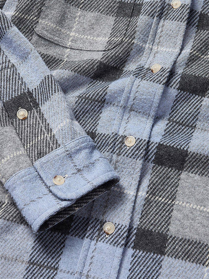 Close-up of the bestselling Faherty Brand Legend Sweater Shirt in True North Plaid, showcasing buttoned cuffs and silver buttons, crafted from custom-developed yarn.