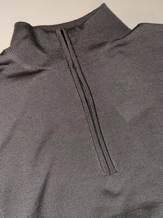A close-up of the Filippo De Laurentiis Royal Merino Mock Quarter Zip in Taupe—a ribbed, gray Merino wool garment featuring a centered black zipper, shown partially unzipped.