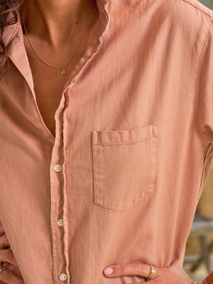 Close-up of a woman wearing a pink Frank & Eileen Mary Classic Shirtdress in Desert with a detailed view of the collar, buttons, and chest pocket.