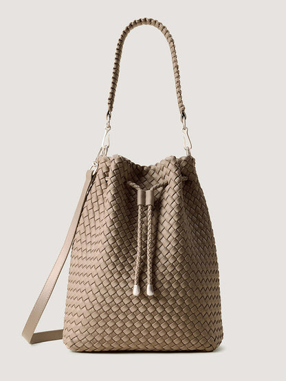 Beige handwoven Naghedi Mercer Large Bucket in Cashmere with a drawstring closure, top handle, and adjustable shoulder strap.