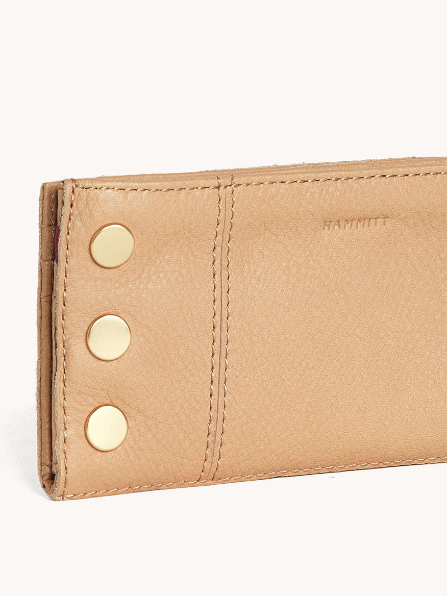 The Hammitt Los Angeles 110 North Wallet in Toast Tan boasts pebbled leather with three gold rivets and multiple credit card slots for convenience.