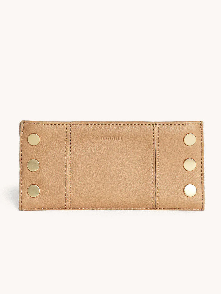 The Hammitt Los Angeles 110 North Wallet in Toast Tan, crafted from pebbled leather, showcases six gold buttons on the front and offers multiple credit card slots for both convenience and style.