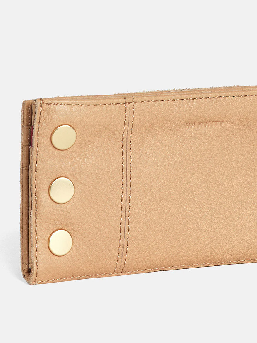 Hammitt Los Angeles 110 North Wallet in Toast Tan with gold-tone rivet details and credit card slots on a white background.