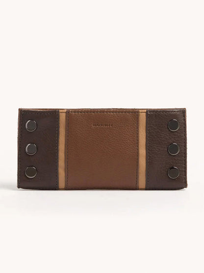 The Hammitt Los Angeles 110 North Wallet in Orchestra Brown is a folding wallet made from pebbled leather, showcasing two-tone brown panels and decorated with six metal button embellishments.