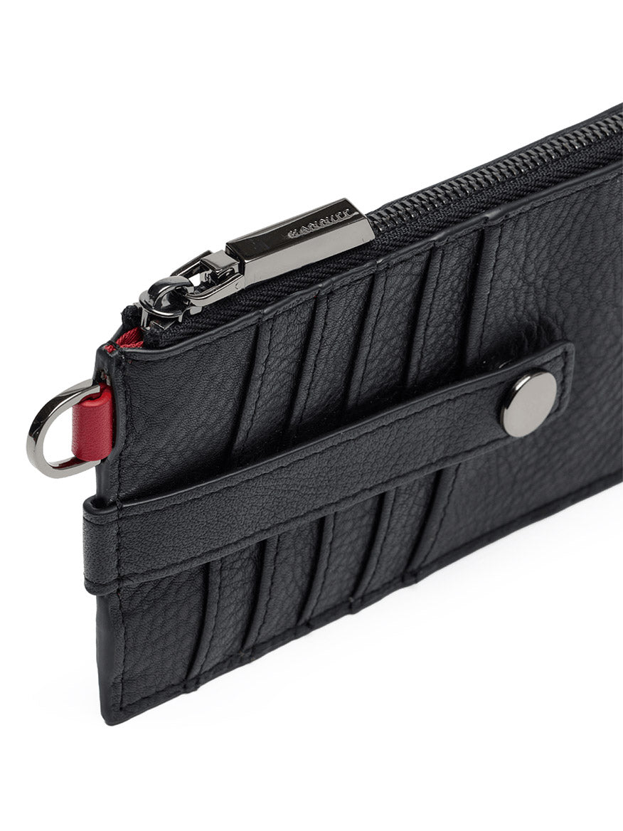 Close-up of the Hammitt Los Angeles 210 East Wallet in Black/Gunmetal, a sleek card holder crafted from black pebbled leather with a ridged design, silver zipper, snap button strap, and a metal ring on the side—a versatile wallet that blends style and functionality.