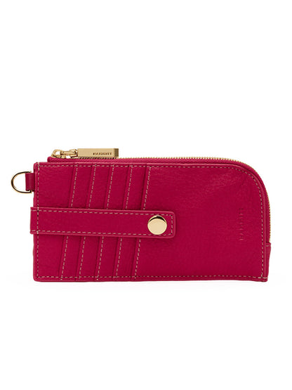 Introducing the Hammitt Los Angeles 210 East Wallet in Calypso Pebble/Gold—a compact, eye-catching women's wallet crafted from vibrant fuchsia pebbled leather with gold hardware. Featuring exterior card slots, a snap strap closure, visible stitching detail, and a handy zippered pocket for secure storage, this sleek accessory is both stylish and functional.