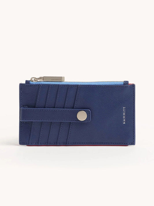 The Hammitt Los Angeles 210 West Wallet in Jazz Blues is a navy pebbled leather wallet with silver hardware, a snap closure, multiple card slots, and a top zipper featuring a logo tag.