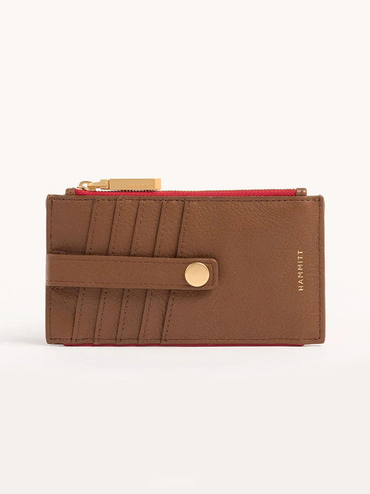 The Hammitt Los Angeles 210 West Wallet in Mahogany Pebble features a soft pebbled leather finish with multiple card slots, a secure snap button strap, and sleek brushed gold hardware topping the zipper.