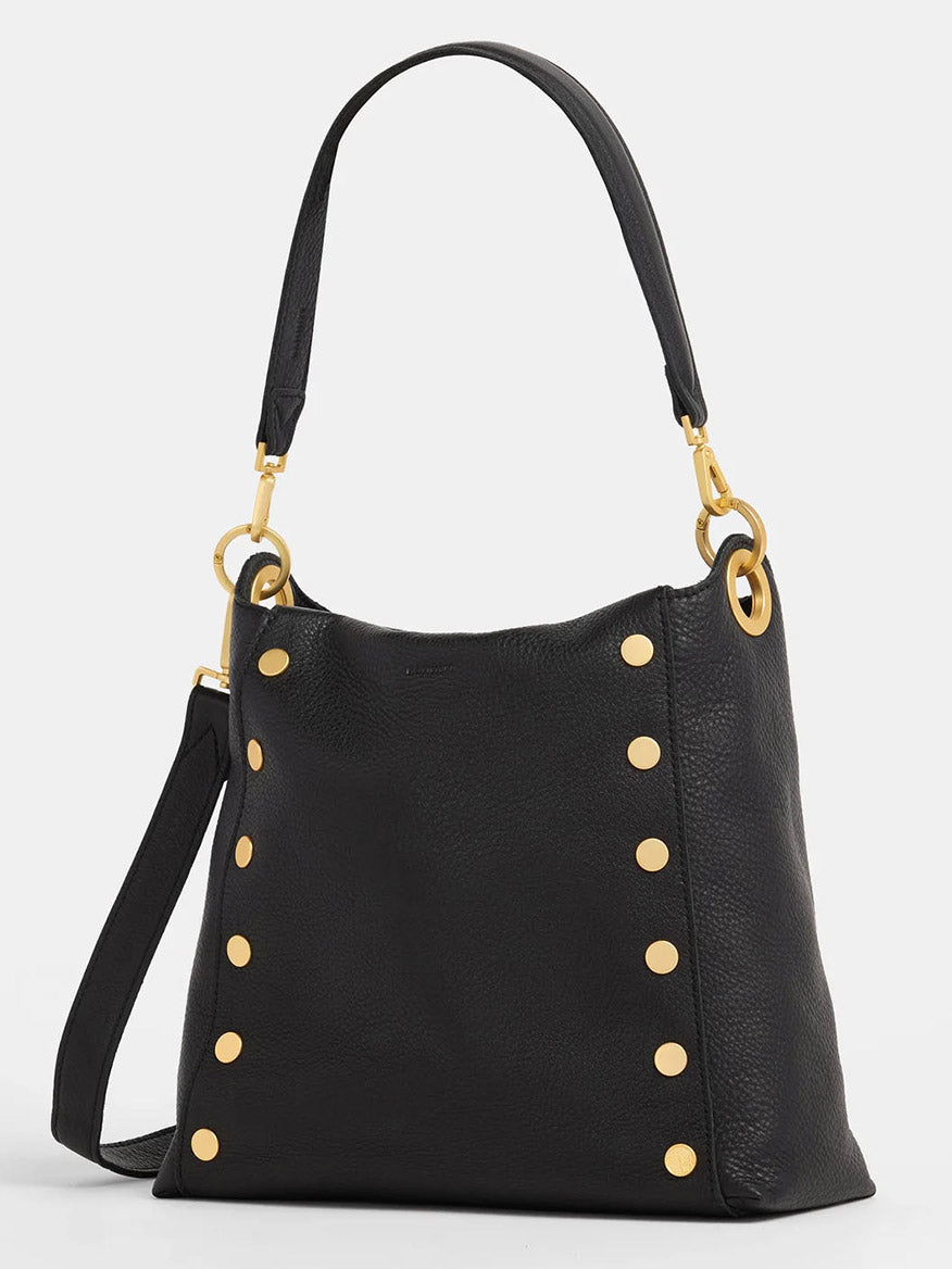 The Hammitt Los Angeles Bryant Large Crossbody Bag in Black & Brushed Gold is crafted from pebbled leather, adorned with gold studs, and features a versatile crossbody strap for effortless style.