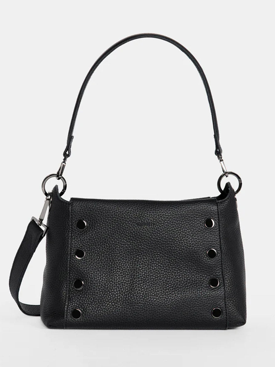 The Hammitt Los Angeles Bryant Medium Crossbody Bag in Black is a black pebbled leather shoulder bag with a single strap and metallic ring accents on the sides, featuring adjustable shoulder straps.