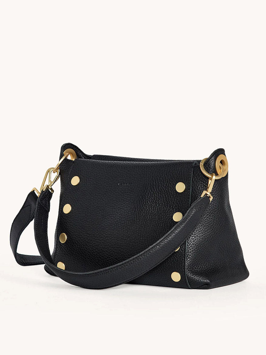 The Hammitt Los Angeles Bryant Medium Crossbody Bag in black pebbled leather features gold studs and a long strap, perfect for everyday use.