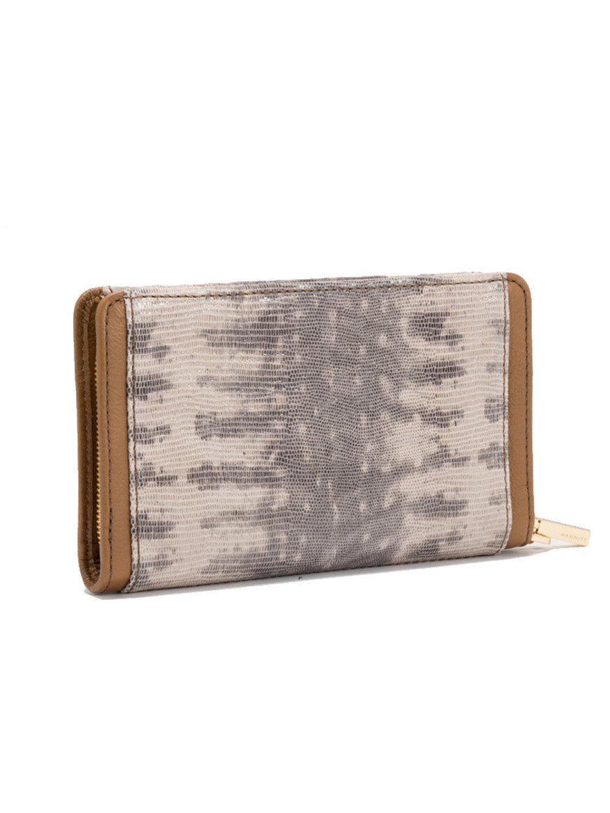 The Hammitt Los Angeles Bryant Wallet in Spotted Smoke/Gold features a rectangular shape, textured gray and beige pattern, brown leather edges, and a gold zipper pull, shown on a white background.