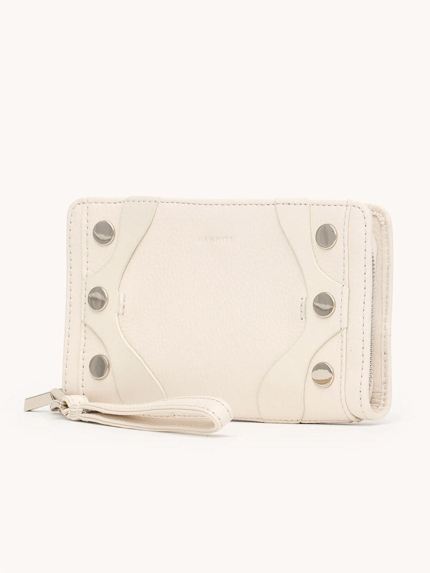 The Hammitt Los Angeles Bryant Wallet in Western Rein/Silver features white pebble leather, silver snap buttons, a zipper closure, and a detachable wristlet, displayed against a plain background.
