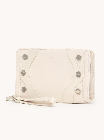 The Hammitt Los Angeles Bryant Wallet in Western Rein/Silver features white pebble leather, silver snap buttons, a zipper closure, and a detachable wristlet, displayed against a plain background.