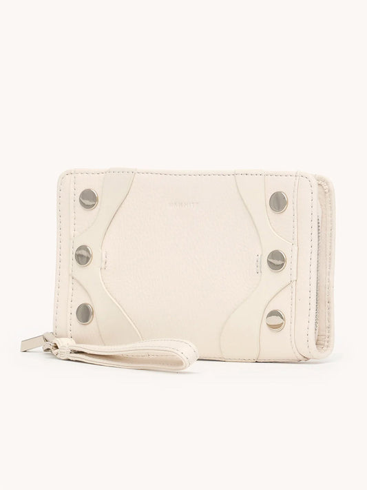The Hammitt Los Angeles Bryant Wallet in Western Rein/Silver features white pebble leather, silver snap buttons, a zipper closure, and a detachable wristlet, displayed against a plain background.