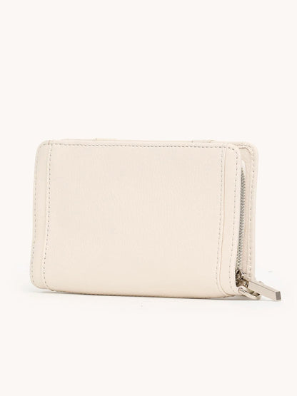 The Hammitt Los Angeles Bryant Wallet in Western Rein/Silver is a compact rectangular pebble leather wallet in light beige, featuring visible stitching and a metal zipper on the right side, photographed against a plain background.