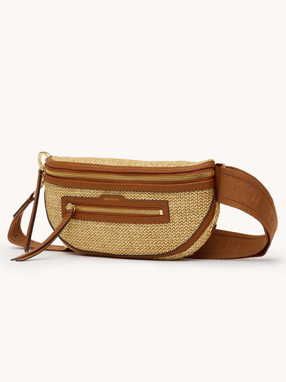 The Hammitt Los Angeles Charles Crossbody Medium in Cocoa Raffia/Gold features woven straw, brown leather trim, a front zip pocket, and a wide adjustable strap, shown against a plain background.