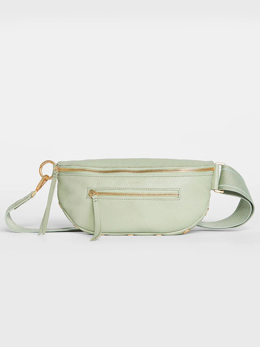 A Hammitt Los Angeles Charles Crossbody Medium in Cypress Sage with multiple zippers, displayed against a neutral background.