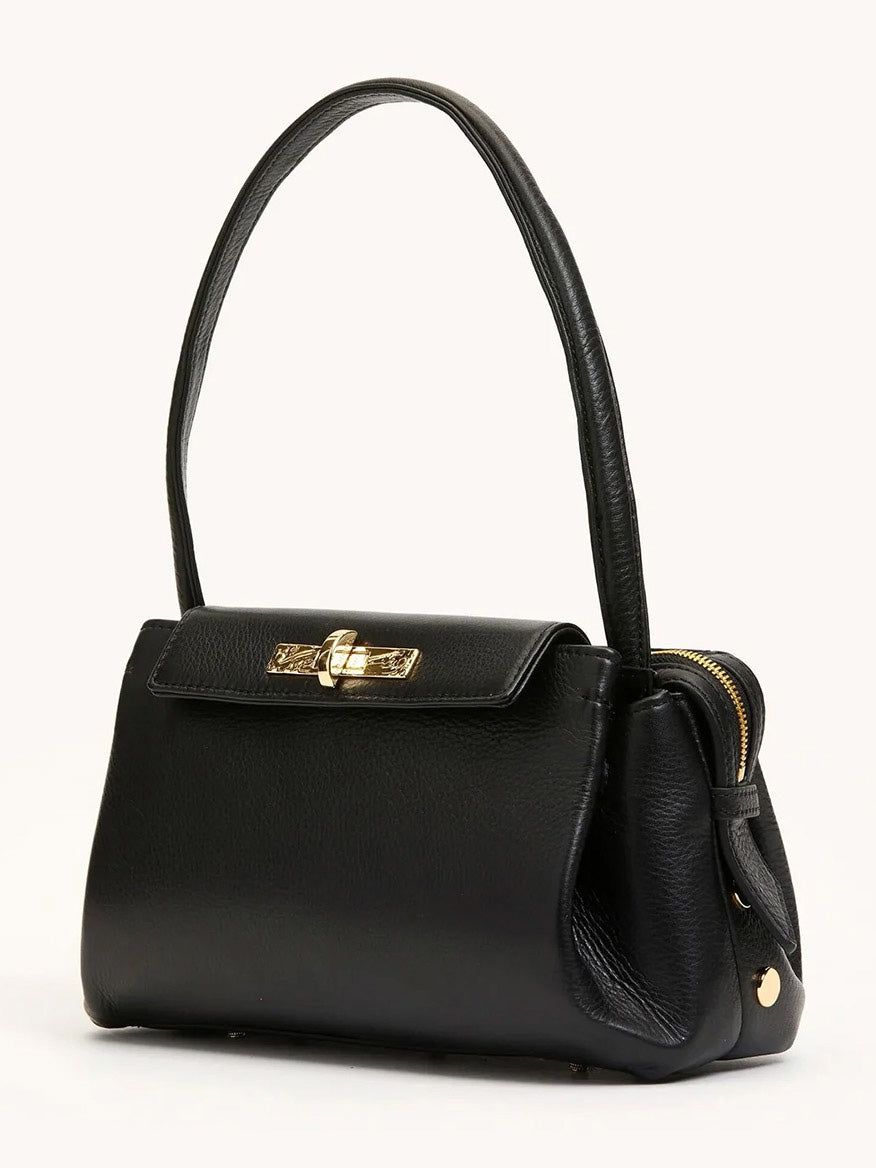 The Hammitt Los Angeles Charlotte Medium in Black/Gold is a black pebble leather handbag with a single top handle, gold-tone hardware, and a flap closure, offering large capacity and stylish functionality for everyday use.